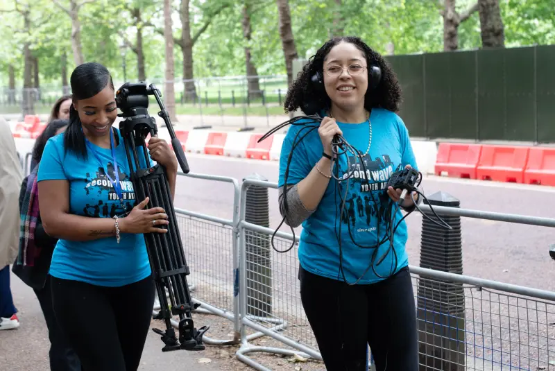 Young people working with cameras