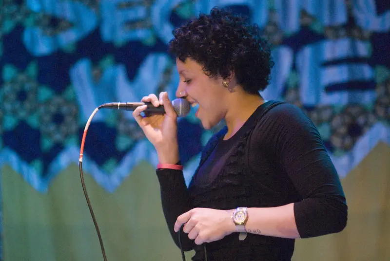 Kloe singing into microphone